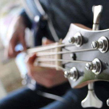 Close-up of someone playing guitar